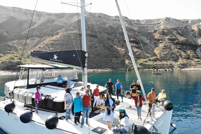 Half-Day Exclusive Catamaran Cruise in Santorini With Meal and Open Bar - Inclusions in the Package