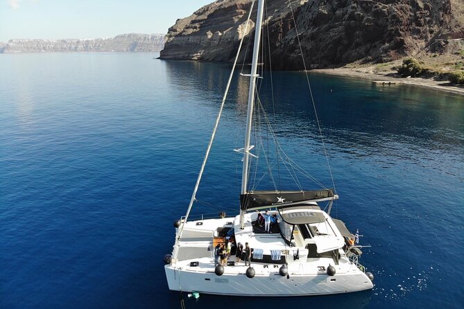 Half-Day Exclusive Catamaran Cruise in Santorini With Meal and Open Bar - Itinerary Details
