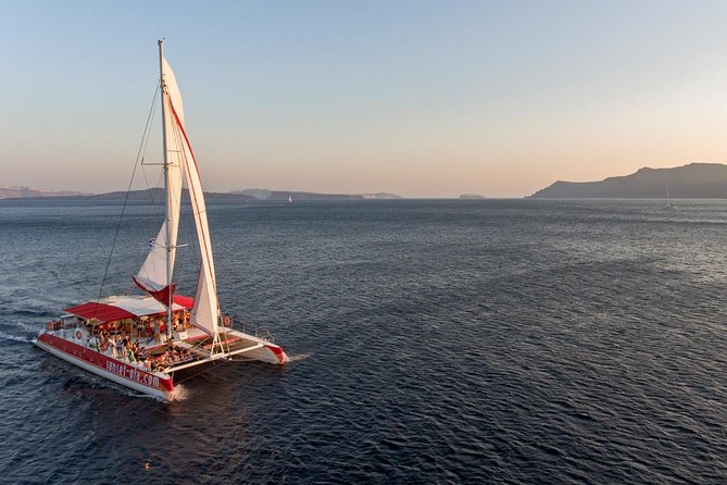 Sailing Catamaran Cruise in Santorini With BBQ, Drinks and Transfer
