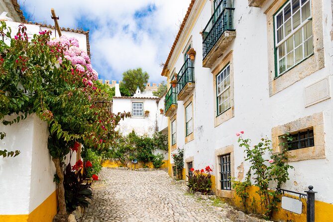 Three Cities in One Day: Porto, Nazare and Obidos From Lisbon - Walking Tour of Obidos