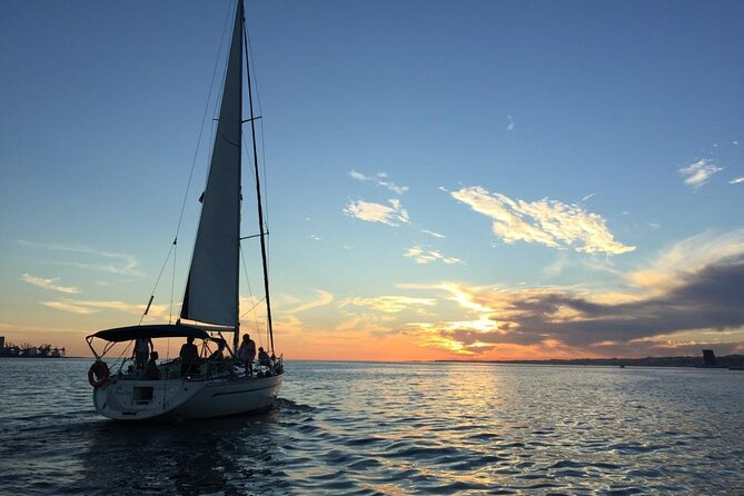 Private Sunset Sailing Tour in Lisbon With Welcome Drink - Overview of the Sunset Cruise