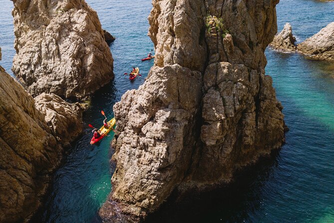 From Barcelona: Tossa De Mar Kayak & Snorkel Tour With Paella - Kayaking the Dramatic Coastline
