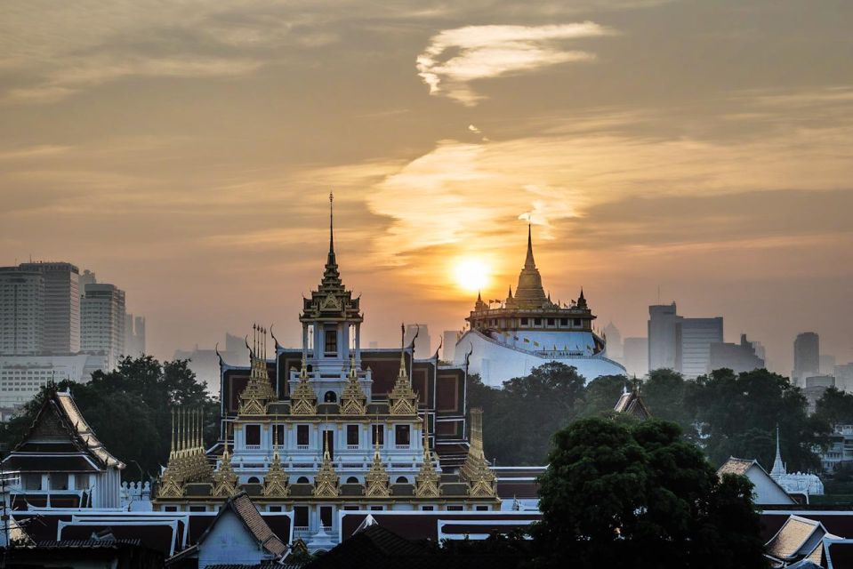 Photo Exploring Bangkok: Ratchanatdaram Temple AM Tour - Captivating Metal Spire and Tiered Structure