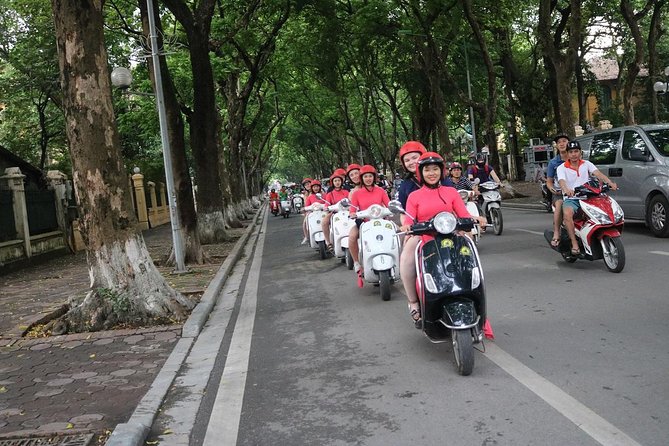 Vespa City Tour + Train Street Female Ao Dai Riders 4,5 Hours - Highlights of the Tour