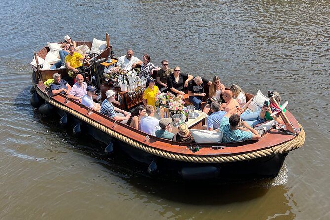 Amsterdam Luxury Boutique Boat Tour With Unlimited Beer and Wine - Unlimited Complimentary Beverages Onboard