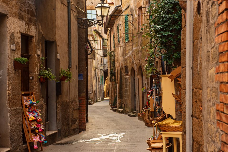 Saturnia Waterfalls and Pitigliano by Bus With Environmental Guide - Bathing in Thermal Waters