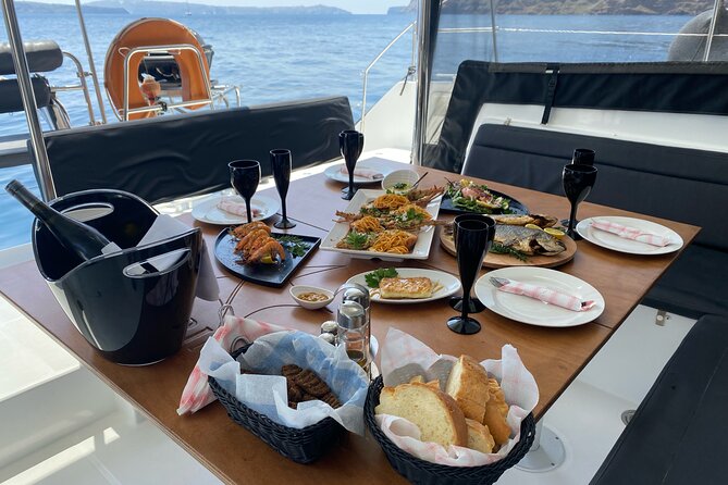 Half Day Premium Catamaran Cruise in Santorini Including Oia - Onboard Swimming and Snorkeling