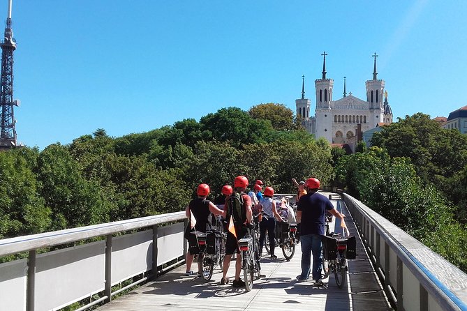 Lyon Electric Bike Tour Including Food Tasting With a Local Guide - Complimentary Drink and Rain Jacket