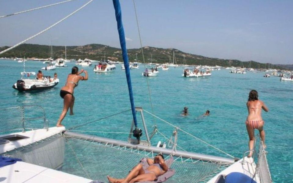 From Cannigione: Catamaran Tour Among the La Maddalena Islands - Boarding the Catamaran