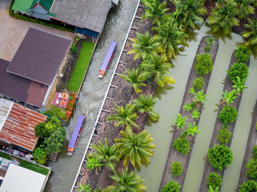 From Bangkok: Railway & Damnoen Saduak Floating Market Tour - Traditional House and Coconut Plantation