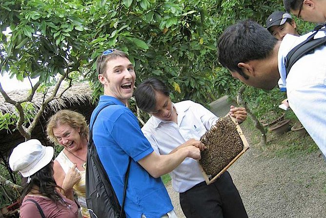 Mekong Delta 1 Day Tour With Lunch Set Menu - Traditional Wooden Rowboat Ride