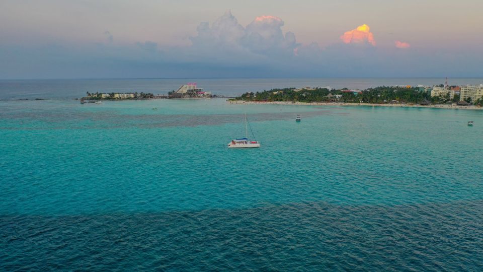 Isla Mujeres Sunset Catamaran With Pick-Up From Cancún - Key Points