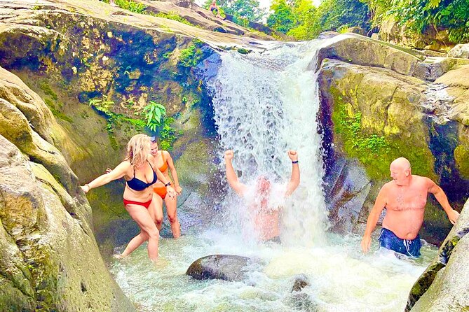 El Yunque: Waterslide, Waterfall, Shopping, and Beach Tour