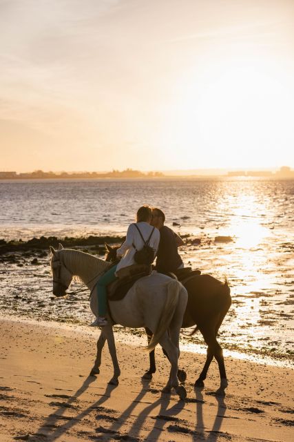 Horseback Riding on the Beach at Sunset