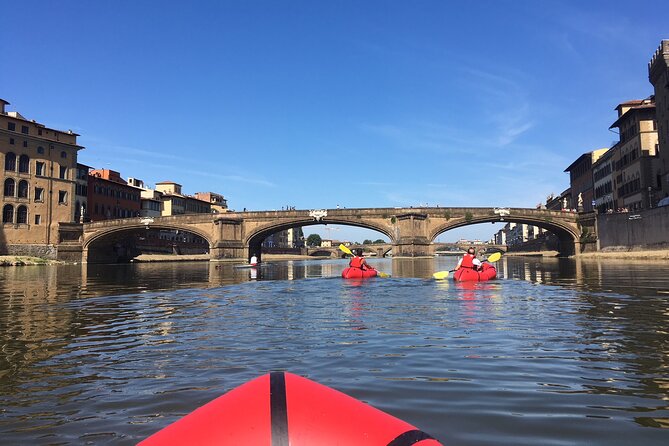 Kayak on the Arno River in Florence Under the Arches of the Old Bridge