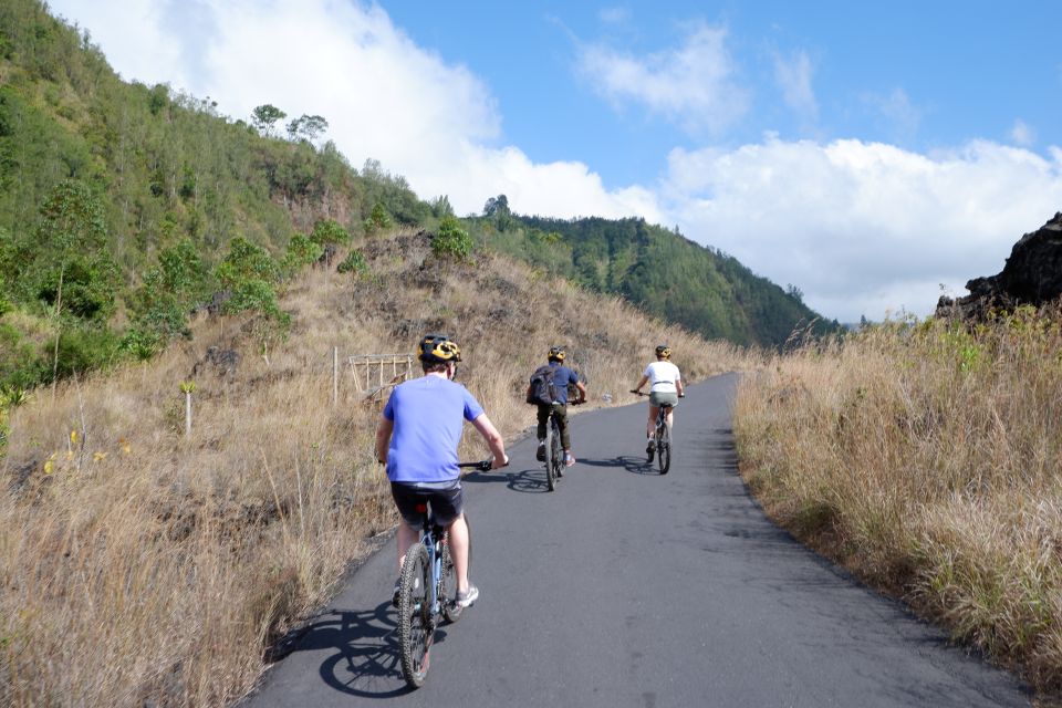 Mount Batur: Black Lava Cycling Tour W/ Natural Hot Spring - Cycling Through Black Lava Streams