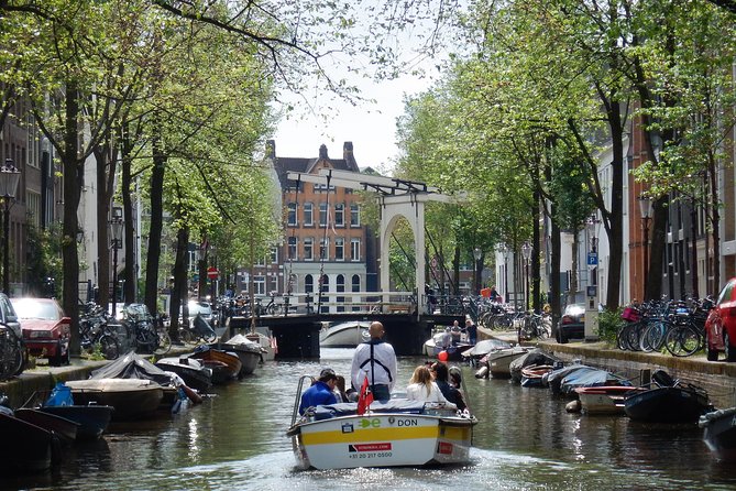 Amsterdam Small-Group Open Boat Tour Off The Beaten Track - Accessibility and Dress Code