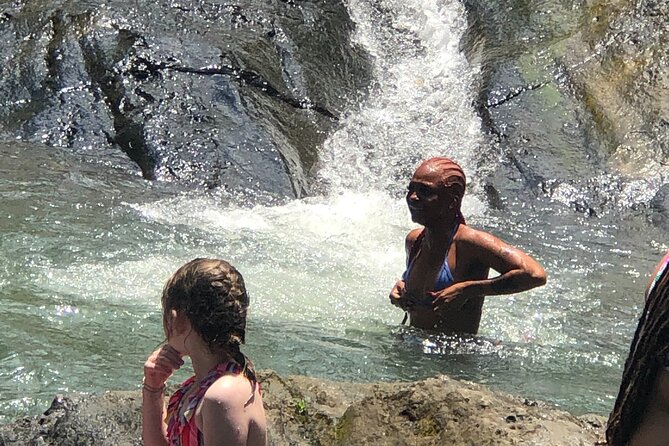 El Yunque: Waterslide, Waterfall, Shopping, and Beach Tour - Itinerary Highlights