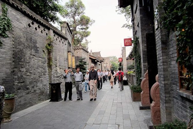 Private Chengdu Day Tour: Giant Pandas and Jinsha Site Museum - Vibrant Shops and Historic Buildings
