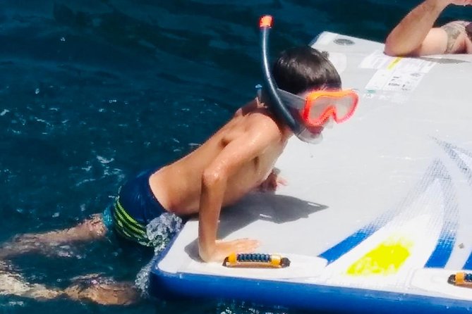 Sailing Along the Costa Brava in a Large Catamaran With a Buffet Barbecue and Bathing Inlet. Drinks Are Included. - Meeting Point and Check-in