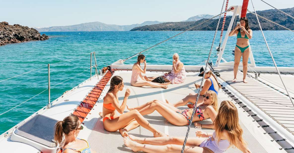 Santorini: Catamaran Tour With BBQ Dinner, Drinks, and Music - Onboard Amenities and Services