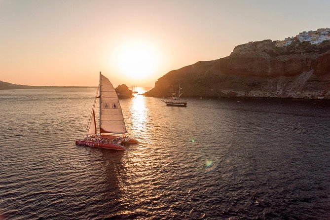 Sunset Sailing Catamaran Cruise in Santorini With BBQ and Drinks - Pickup and Departure