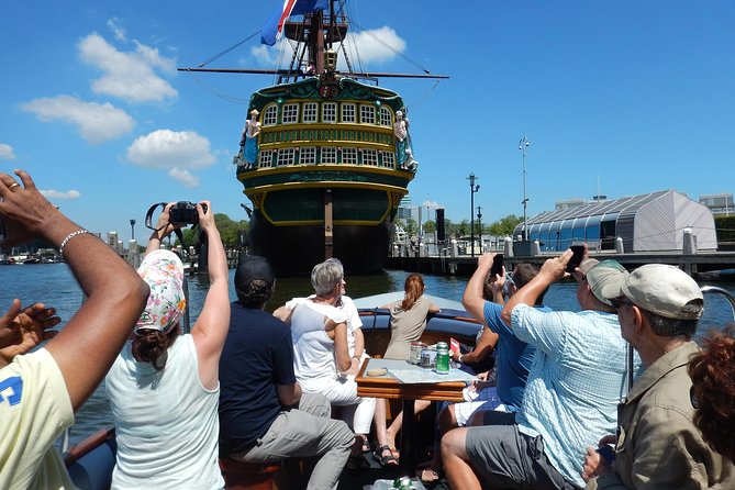 Amsterdam Small-Group Open Boat Tour Off The Beaten Track - Transportation and Refreshments