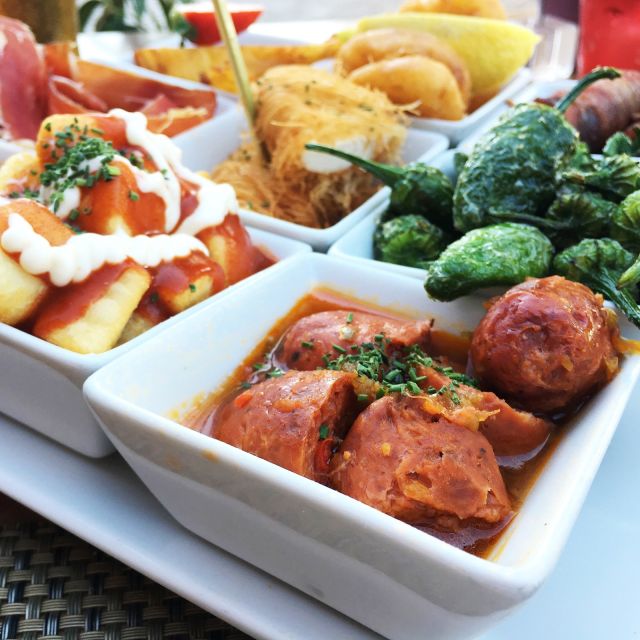 Seville: 3-Hour Guided Tapas Tour in Seville - Exploring Triana District