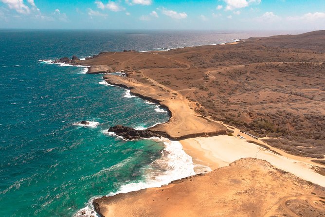 Aruba Jeep Tour: Natural Pool, Caves, and Baby Beach Adventure - Traveling in Comfortable Land Rovers