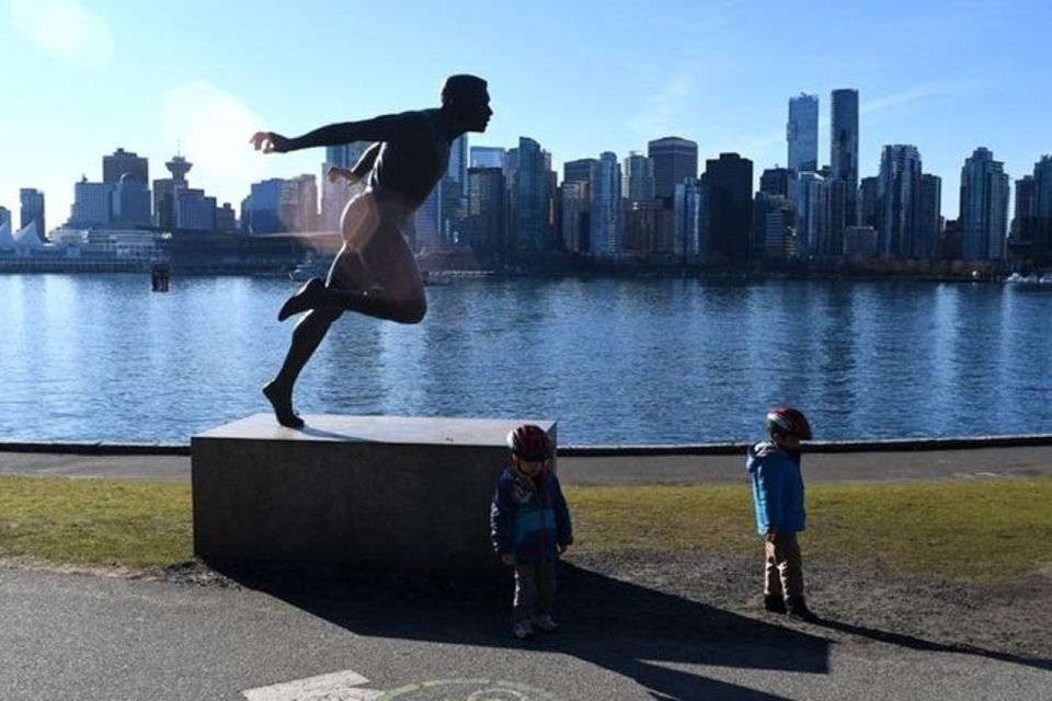 Best Selling Vancouver Sightseeing Tour - Admiring Totem Poles