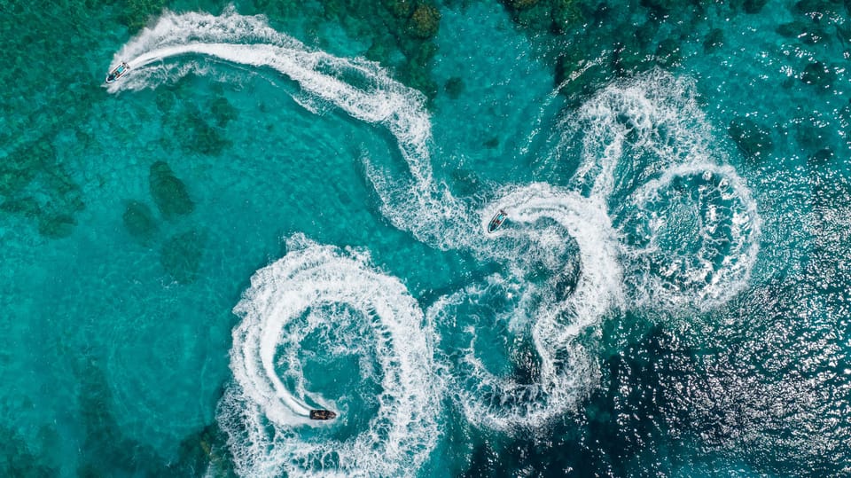 Calanova: Double Jet Ski Excursion With Guide - Booking and Cancellation