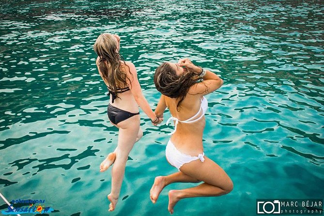 Sailing Along the Costa Brava in a Large Catamaran With a Buffet Barbecue and Bathing Inlet. Drinks Are Included. - Traveler Capacity