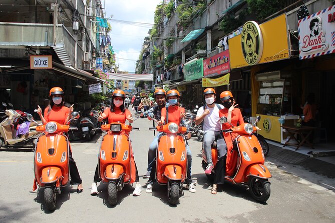 The Insiders Saigon With Female Ao Dai Riders Vespa 4,5 Hours - Booking and Cancellation Policy