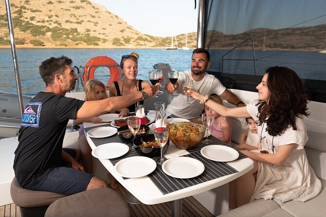 Agios Nikolaos Evening Catamaran Cruise in Mirabello With Dinner - What to Expect on Board