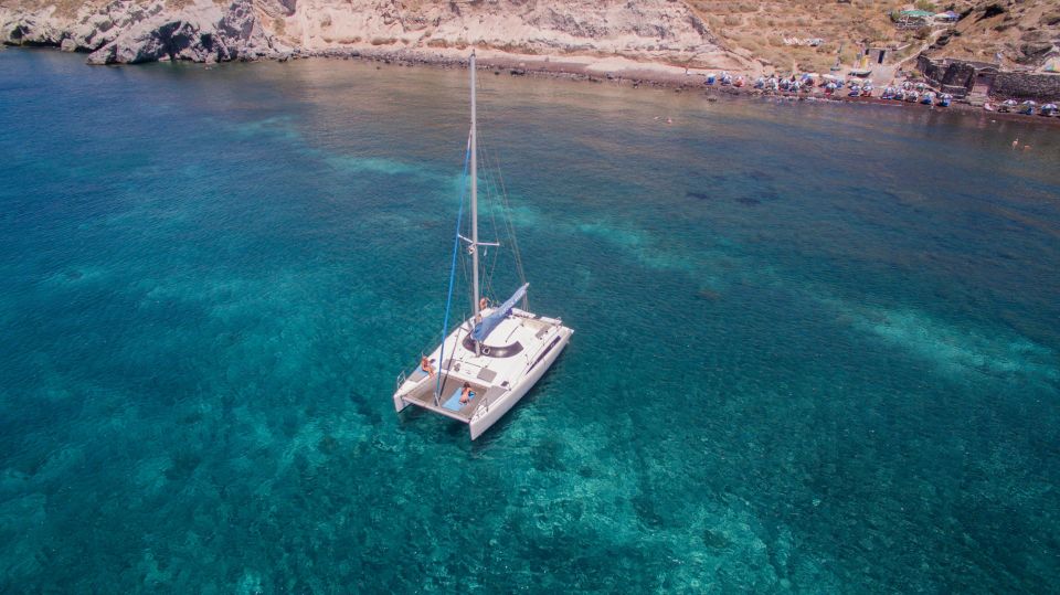 Santorini:Catamaran: Private Cruise With Food & Drinks - Family Business Commitment