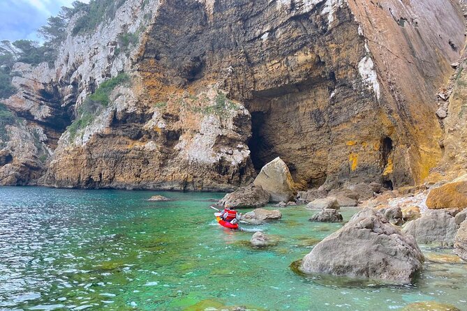 Kayak Paradise: Cala Portixol Snorkel, Cave & Cliff Jumping Tour - Cliff Jumping on Isla De Portixol