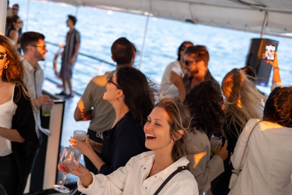 Lisbon: Catamaran Boat Party With Music, Open Bar & Swimming - Key Points