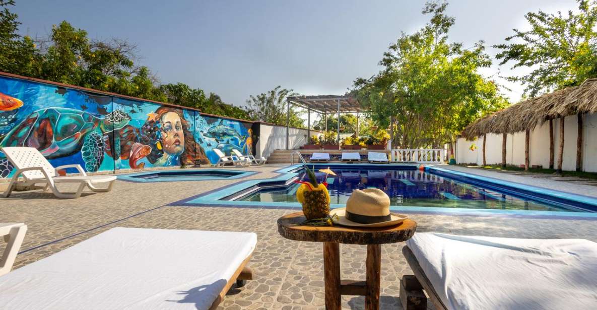 Tierra Bomba: Day Tour in a Beach Club With Pool in Punta Arena - Pricing and Duration