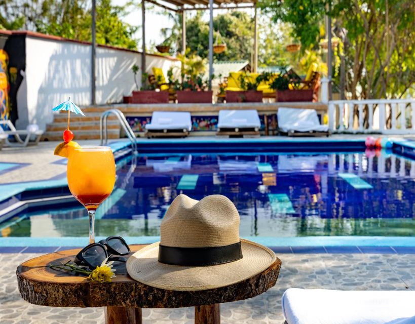 Tierra Bomba: Day Tour in a Beach Club With Pool in Punta Arena - Key Points