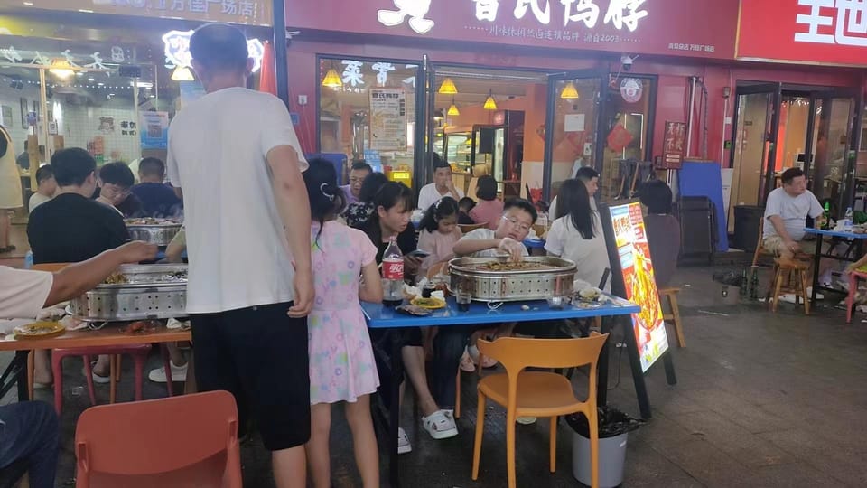 Qingdao Walking Night Tour With Seafood Hot Pot and Beer - Dining Experience