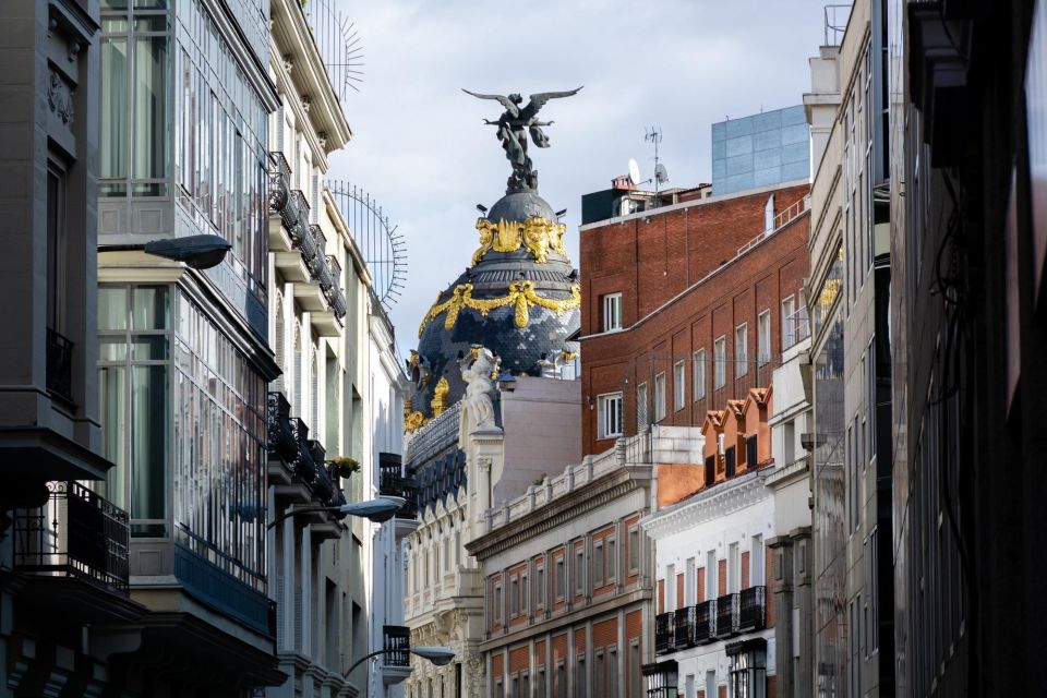 Madrid: Express Walk With a Local in 90 Minutes - Experience Highlights