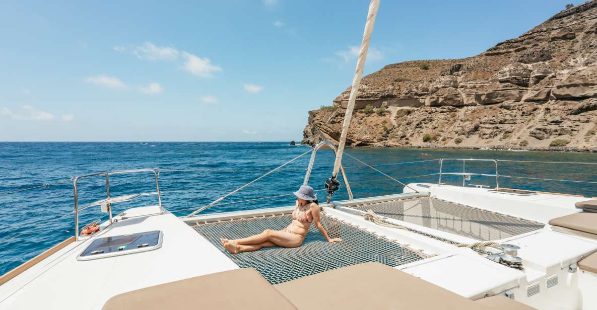 Santorini: Luxury Catamaran Day Trip With Meal and Open Bar - Itinerary and Activities