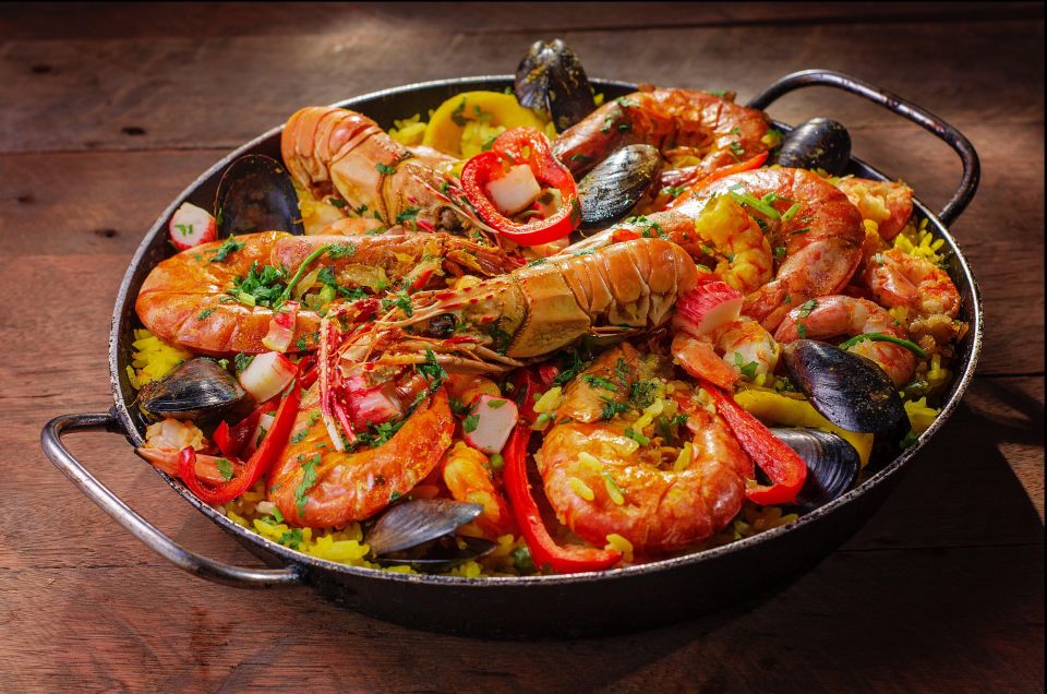 Tapas Tour Paella and Malaga Market With Official Guide - Itinerary Highlights