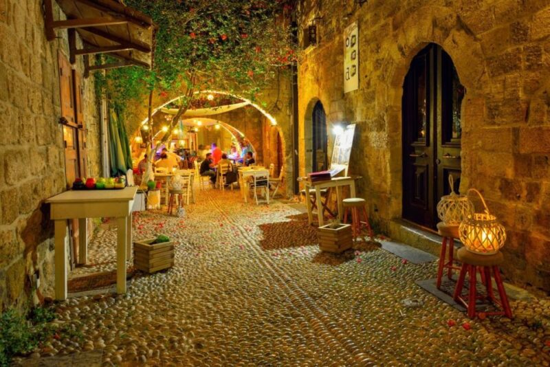 Night Rhodes: Old Town Gastro E-Bike Tour With Drink & Meze - Evening Ambiance