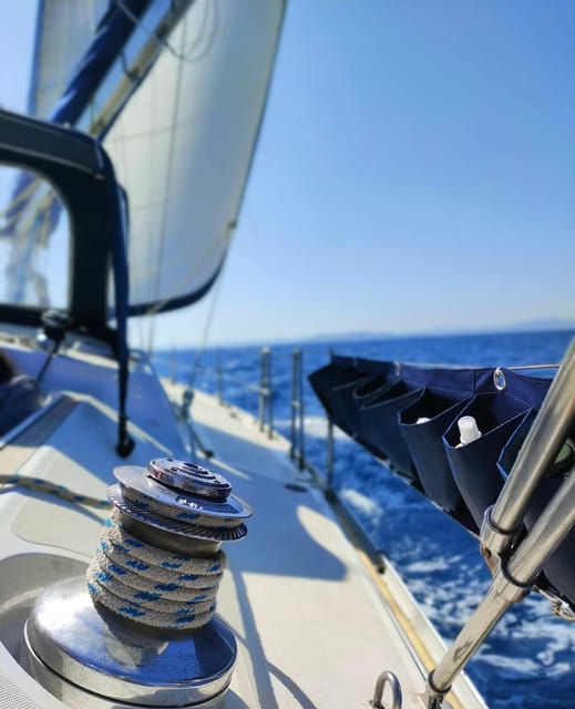 Sunset Sailing Trip Along Alghero Coastline With Apéritif - Pricing and Reservation