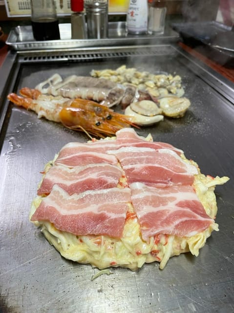 Okonomiyaki Cooking at a Traditional Restaurant. - Unique Features of the Experience