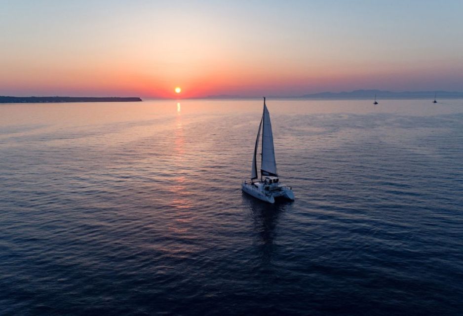 Santorini: Sunset Cruise With Swim Stops, Dinner, and Drinks - Swim Stops and Snorkeling