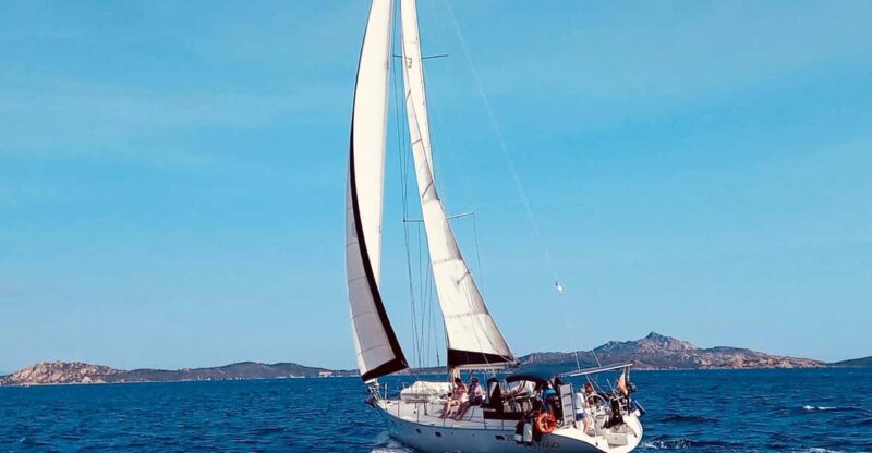 Half Day Tour Alghero - 15 M Sailing Boat - Steering the Boat
