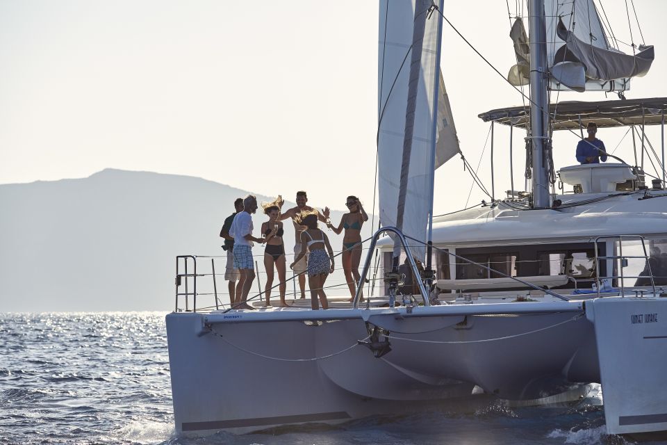 Santorini: Luxurious Catamaran Cruise With Meal & Open Bar - Booking Process