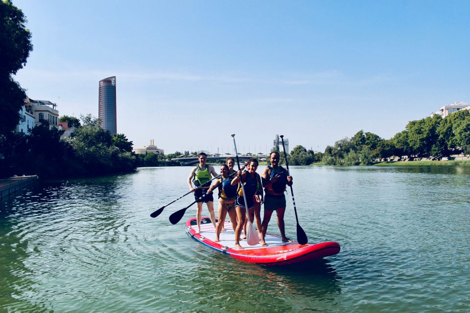 Seville: Group Giant Paddle-Boarding Session - Teamwork on the Water